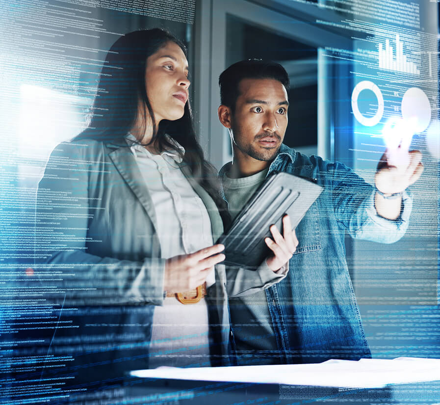 Two professionals using a digital touchscreen interface to review data visualizations.