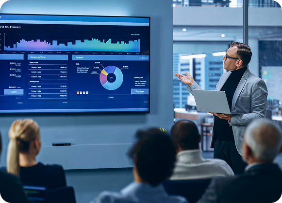 Professional presenting data visualizations to a team, representing a key stage in the digital transformation process.