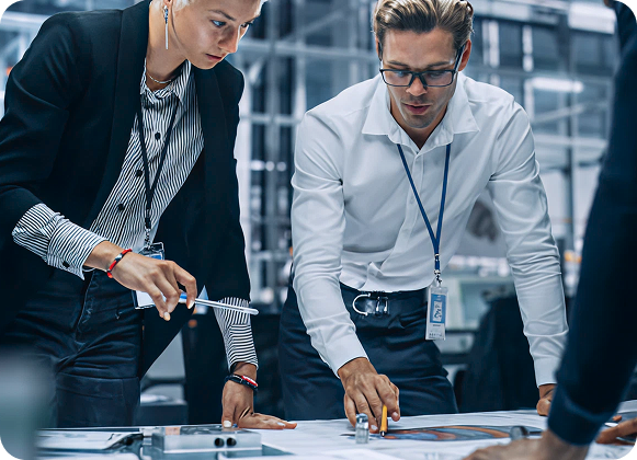 Professionals collaborating on a project plan, illustrating a step in the digital transformation process.