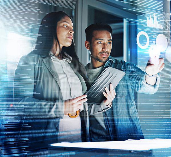 Two professionals using a digital touchscreen interface to review data visualizations.