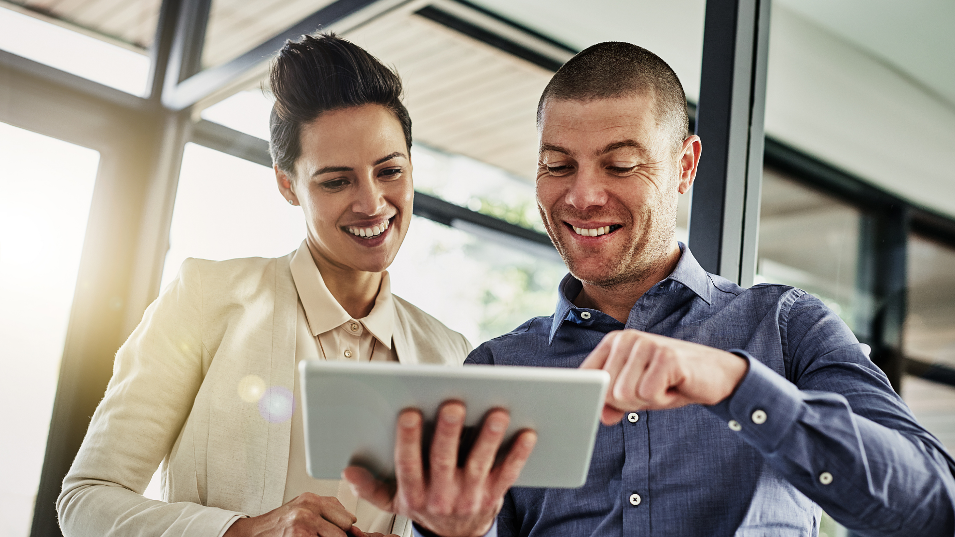 Professionals reviewing digital platform insights on a tablet