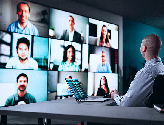 Team leader in a video conference with colleagues, representing RevStar’s digital transformation services.