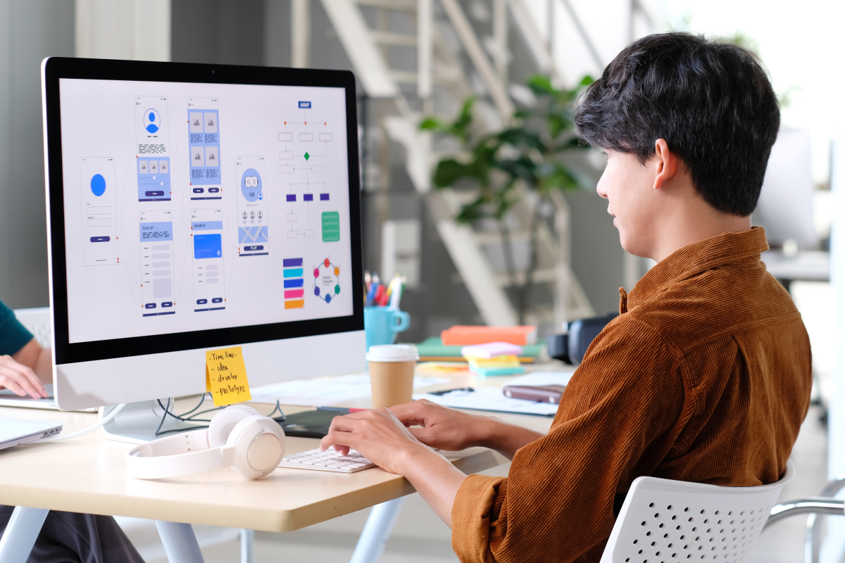 Man working on UI/UX on a computer